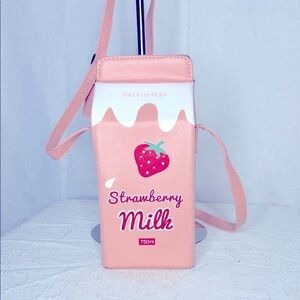 Strawberry milk carton vegan handbag. Adjustable straps.